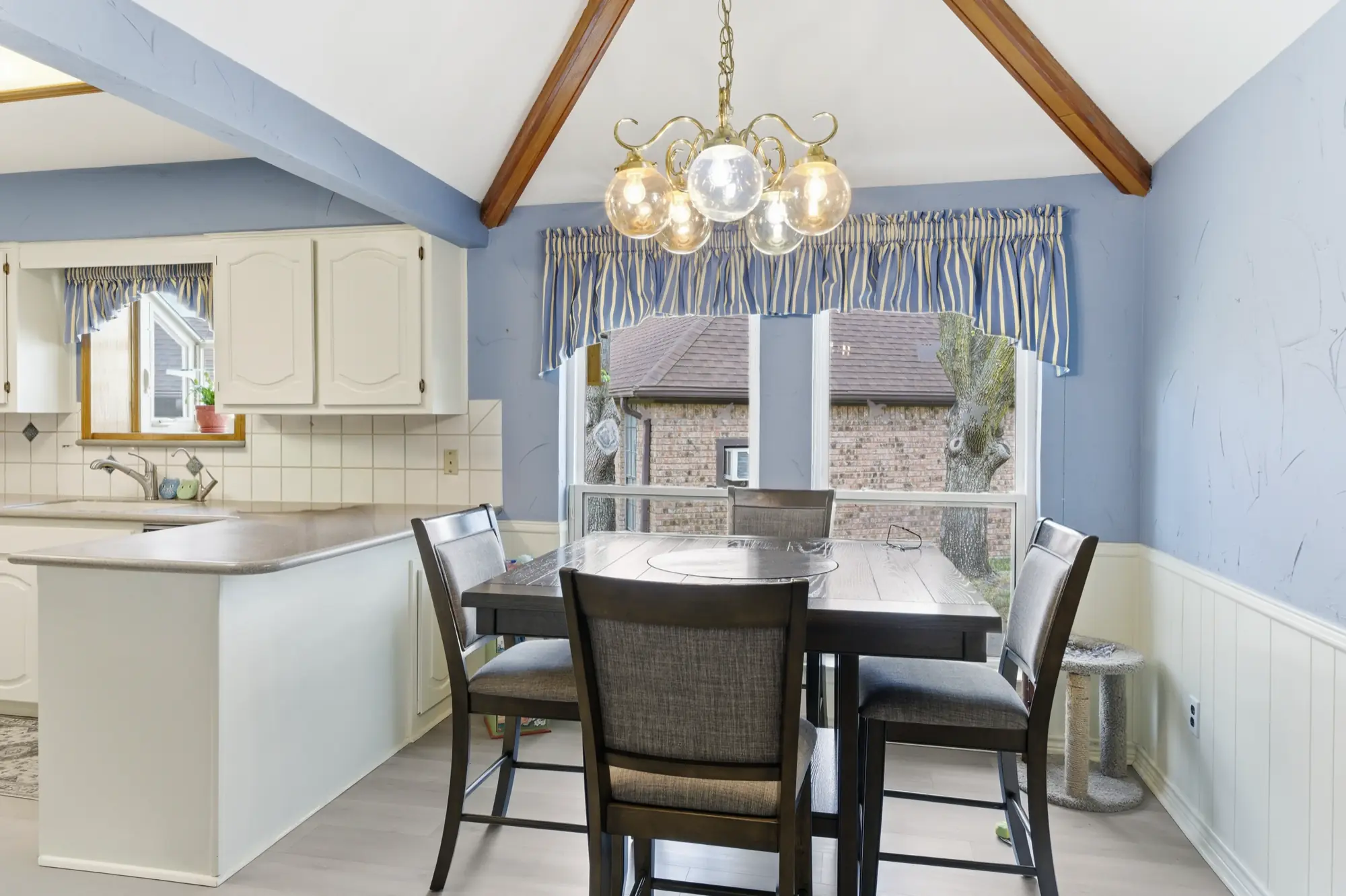 Breakfast nook with vaulted ceiling and exposed beams